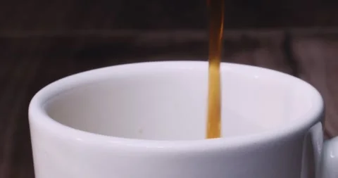 Coffee filled into the ceramic cup Stock Footage 244444679