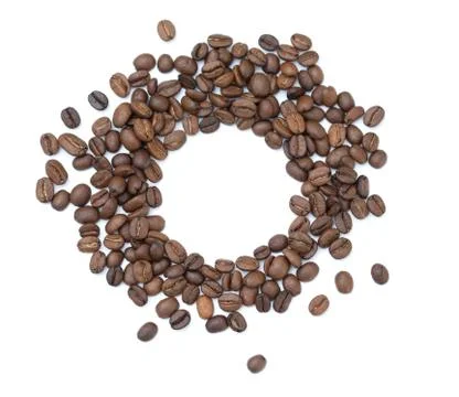 Coffee flat lay: an empty white background circle surrounded by coffee beans Stock Photos