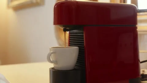 Coffee flowing into cup from capsule machine, morning routine Stock Footage 329184634