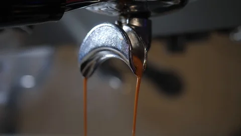 Coffee flows from cofee machine Stock Footage 125666649