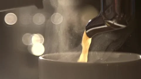 Coffee flows from cofee machine in slow motion Stock Footage 58865012