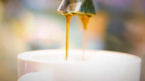 Coffee flows from a coffee machine Stock Footage 82302906