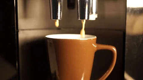 Coffee flows from the coffee maker into a disposable cup. Stock Footage 119071875