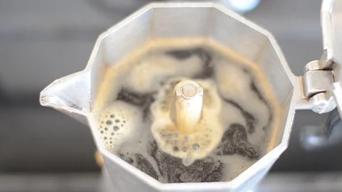 Coffee flows from a geyser coffee maker Stock Footage 116593281