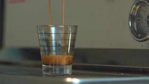 Coffee flows into Measuring cup of Coffee Maker. Video stock 99116357