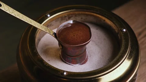 Coffee foam rises in the cezve Stock Footage 309952367
