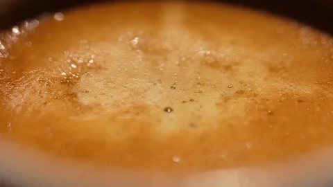 Coffee foam texture macro shot slow motion Stock Footage 83994412