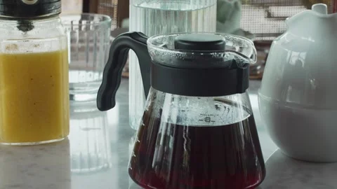 Coffee at a Full Breakfast Table in the Morning and Orange Juice Close To It Stock Footage 263965822