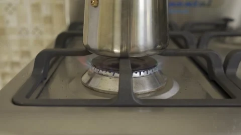 Coffee in a geyser coffee maker is brewed on a gas stove. HLG REC2020 Stock Footage 229073167