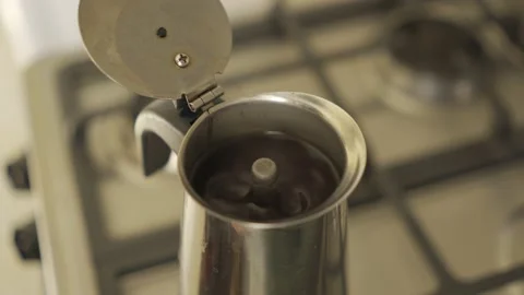Coffee in a geyser coffee maker is brewed on a gas stove, boiling. HLG3 BT.2020 Stock Footage 229441625