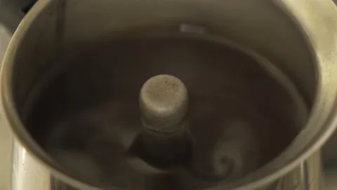 Coffee in a geyser coffee maker is brewed on a gas stove, boiling. HLG3 BT.2020 Video stock 229441629
