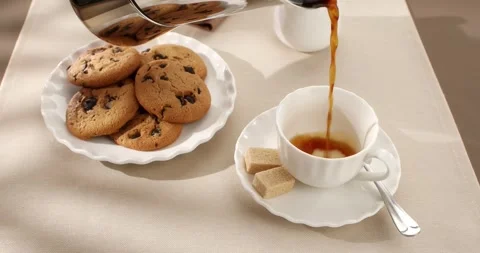 Coffee from a geyser is poured into a cup. Breakfast scene. Hight angle view. Stock Footage 242590005