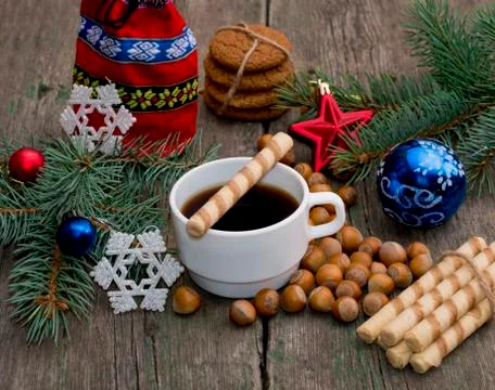 Coffee, gift bag, nutlets. baking and fir-tree branch Stock Photos