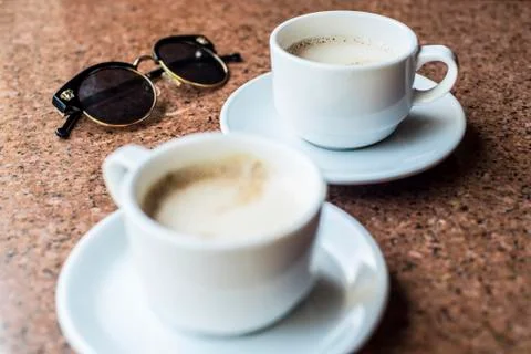 Coffee with glasses on the table. Delicious baking with a coffee. Stock Photos