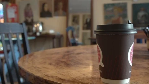 Coffee to go cup on a bar table in Petersburg Stock Footage 91957326