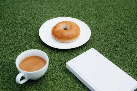 Coffee, a good book and bread for a good morning in cafeteria Stock Photos