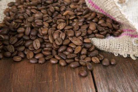 COFFEE GRAIN IN A BAG ON A RURAL TABLE Stock Photos