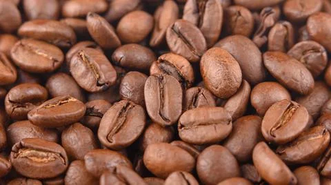 Coffee grains background macro under hard light. Photo horizontal HD Stock Photos