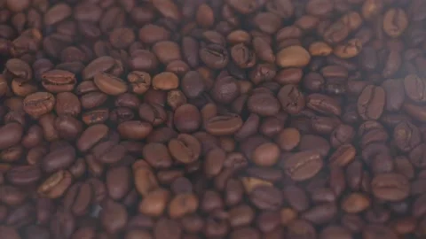Coffee grains close up with smoke Stock Footage 198980989