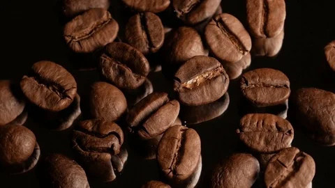 Coffee grains macro rotate with specular reflection Stock Footage 74775329