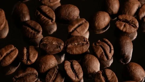 Coffee grains macro rotate with specular reflection Stock Footage 74775484