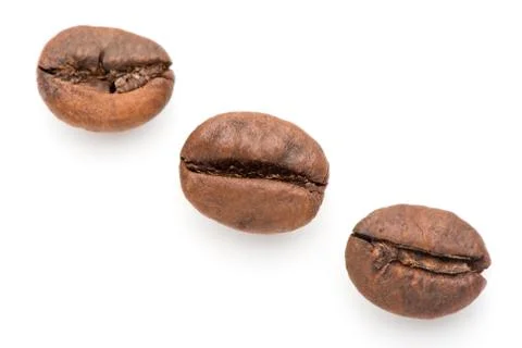 Coffee grains on a white background. fried coffee beans Stock Photos