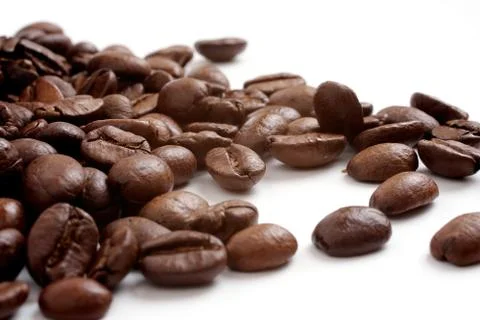 Coffee grains on a white background Stock Photos
