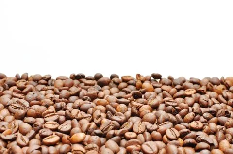 Coffee grains on a white background Stock Photos