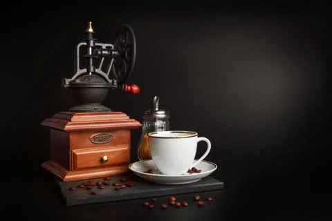 Coffee grinder and cup Stock Photos
