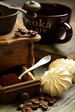 Coffee grinder and marshmallows. Stock Photos