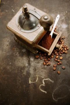 Coffee grinder with beans and ground coffee Stock Photos