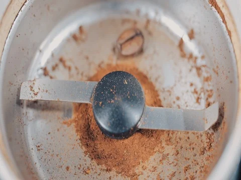 Coffee Grinder with beans shot from above. Slow motion Stock Footage 73671560