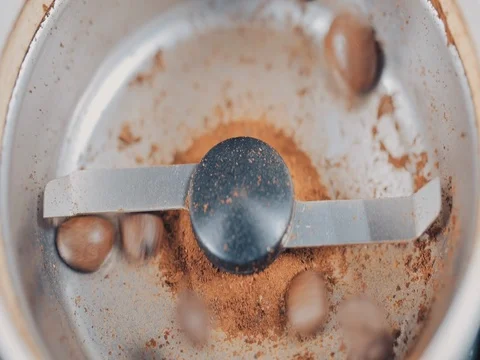 Coffee Grinder with beans shot from above. Slow motion Video stock 73672075