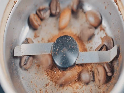 Coffee Grinder with beans shot from above. Slow motion Video stock 73672317