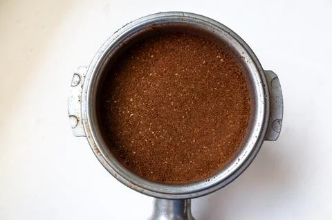 Coffee grinder with a brown substance inside Stock Photos