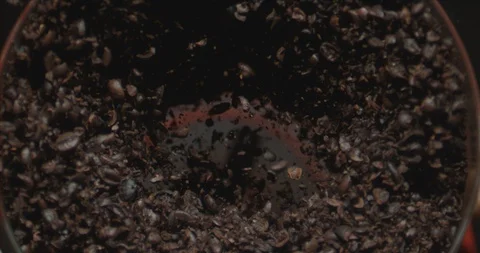 A coffee grinder full Coffee Beans grinding in slow motion Stock Footage 97808600