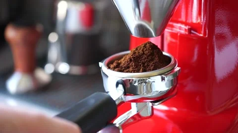 Coffee grinder grinding freshly roasted Stock Footage 64310139