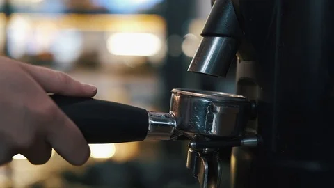 Coffee grinder grinds coffee beans into a filter holder Stock Footage 119236176