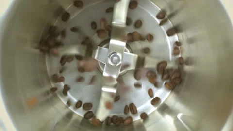 Coffee grinder grinds coffee beans. Slow-motion video. Video stock 171337730