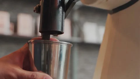 Coffee grinder machine making ground coffee powder. close up automatic coffee gr Stock Footage 159401688