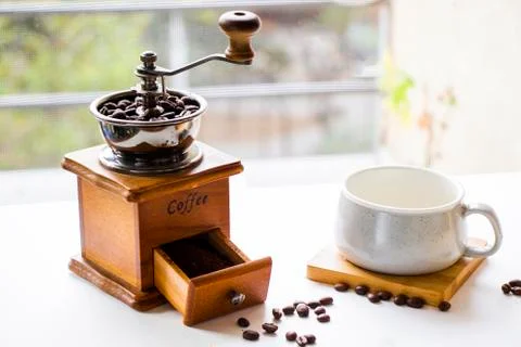 Coffee grinder, maker, cup and beans, morning coffee Stock Photos
