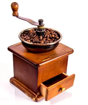 Coffee grinder on a white background with coffee beans Stock Photos