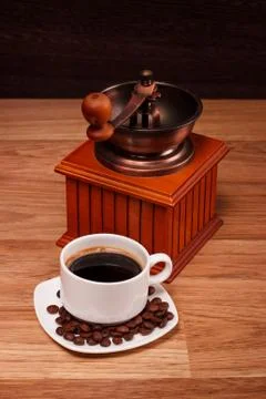 Coffee grinder with white cup  Stock Photos