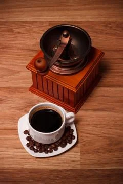Coffee grinder with white cup  Stock Photos