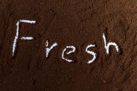 Coffee ground with fresh text on Stock Photos