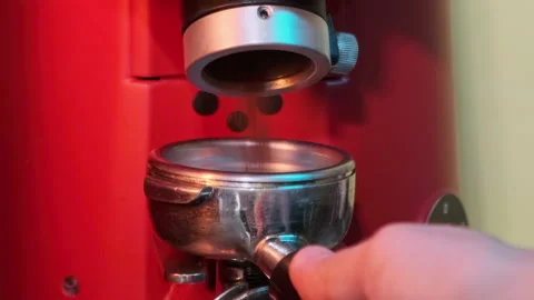 Coffee is ground into the holder. Slow motion. Stock Footage 183951286