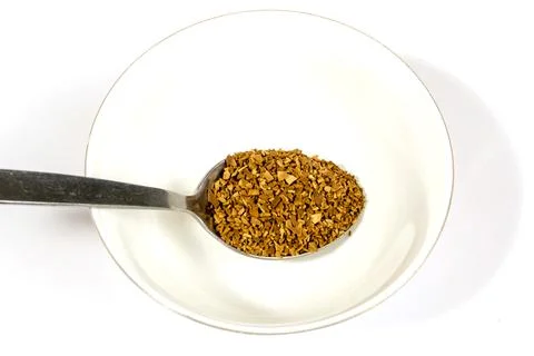 Coffee ground in stainless table and tea spoon Stock Photos