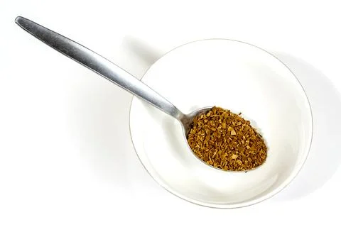 Coffee ground in stainless table and tea spoon Foto stock