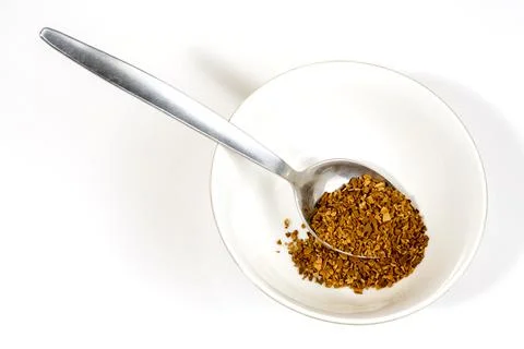 Coffee ground in stainless table and tea spoon Foto stock