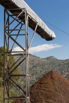 Coffee grounds has been thrown away from conveyor. Stock Photos